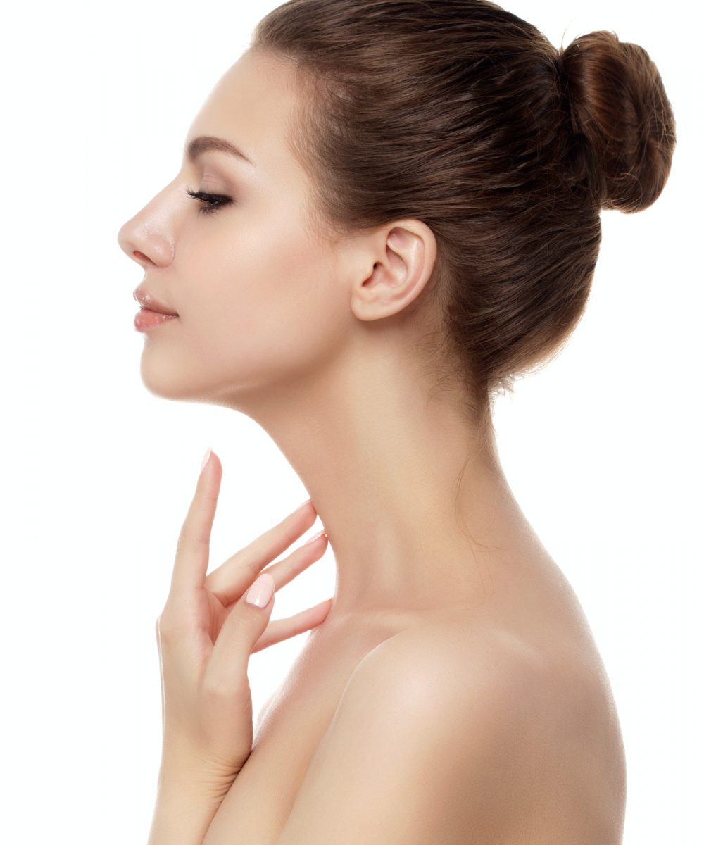 Young beautiful woman touching her neck Young beautiful woman touching her neck